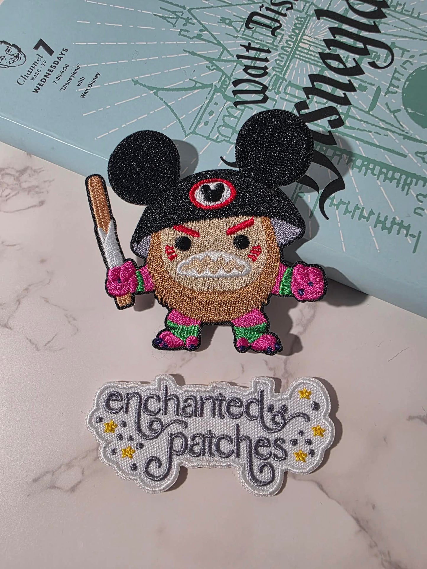3" Coconut Man Island Hawaiian Holding Churro with Ears Embroidered Iron On Patch