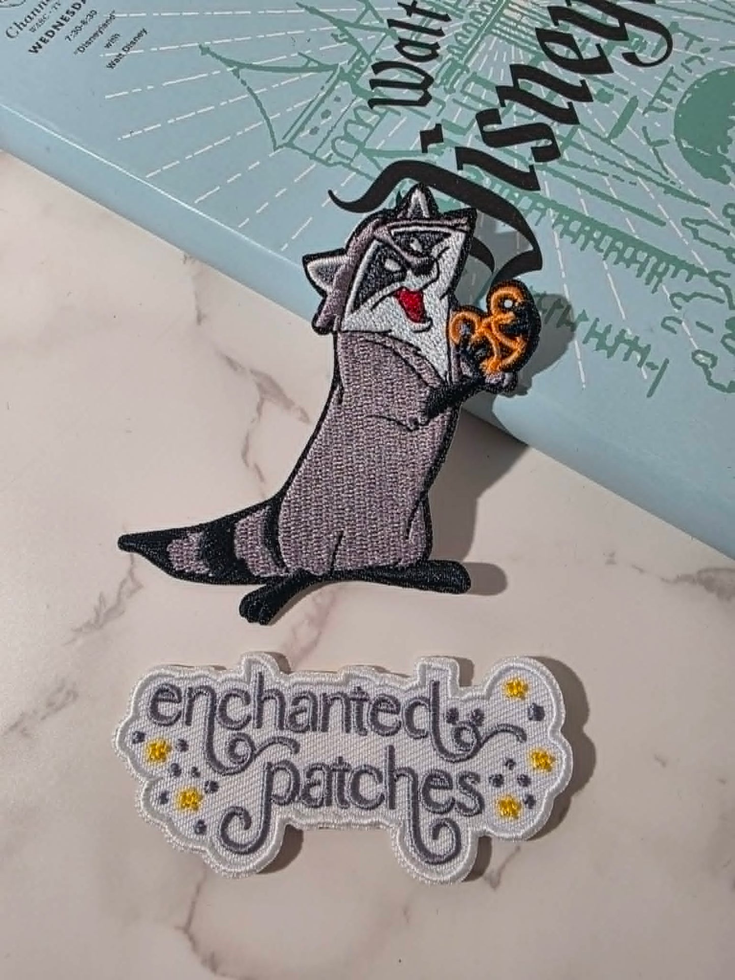 NEW DROP - 3" Racoon Sidekick with Mouse Shaped Pretzel Embroidered Iron On Patch